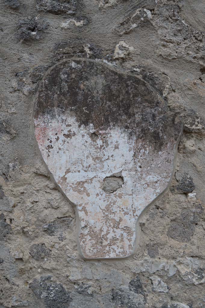 I.11.7 Pompeii. October 2018. Detail of remaining stucco on wall to south of street altar.
Foto Taylor Lauritsen, ERC Grant 681269 D�COR.

