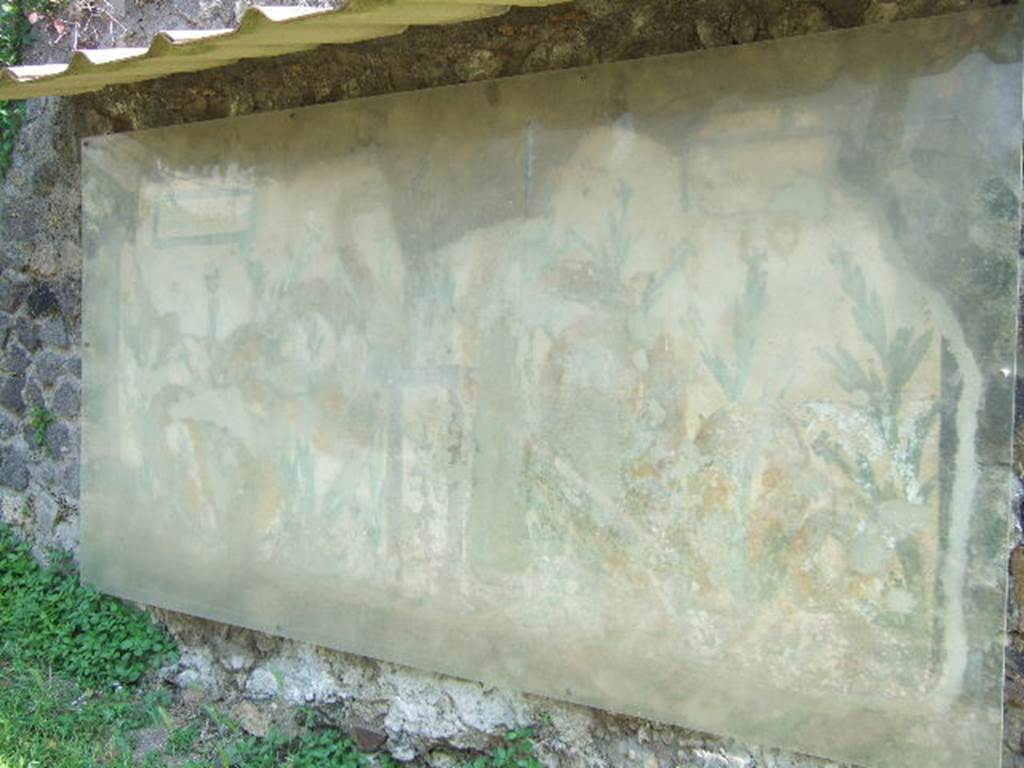 Painted street shrine on the wall at V.6.19. December 2005.