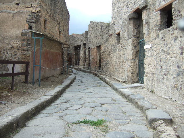 VII.11.13  Pompeii. December 2005. Painted street shrine on outside wall.   
In the past in white letters above the painting were the words 
Otiosis locus hic non est. Discede morator. (CIL IV, 813) 
(This is not the place to idle, Shove off, loiterer”. (Trans by P. Foss)



