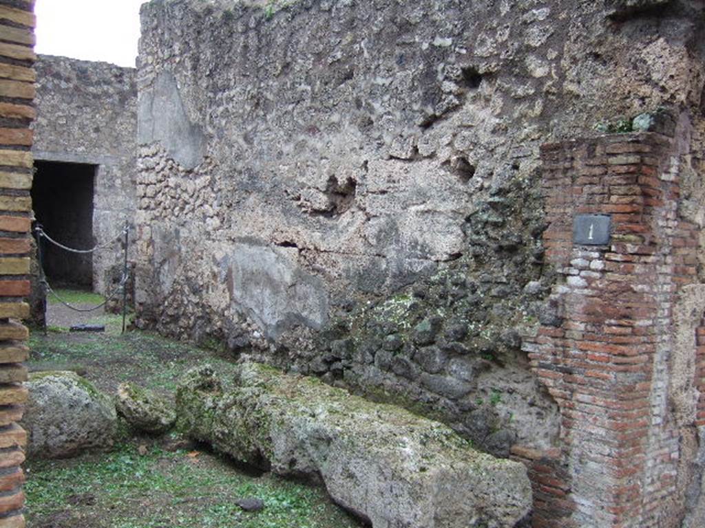 IX.2.1 An arcade of three arches containing street altar. December 2005. South wall.  According to Eschebach, there was a shrine for the Lares Compitales on this wall, with an altar to the right, no longer there.
See Eschebach, L., 1993. Geb�udeverzeichnis und Stadtplan der antiken Stadt Pompeji. K�ln: B�hlau. (p.404)  Fiorelli also described it as a Compitum, similar to the one in the same street at VIII.4.24.  See Pappalardo, U., 2001. La Descrizione di Pompei per Giuseppe Fiorelli (1875). Napoli: Massa Editore. (p.141)

