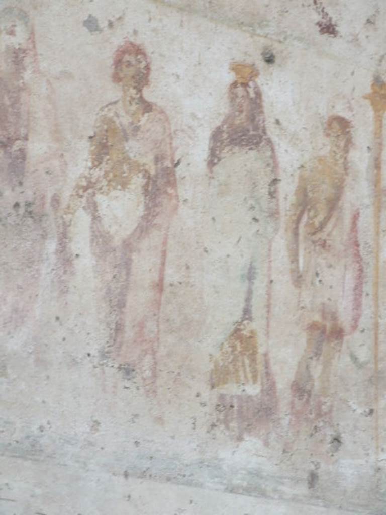 Detail of Mercury outside IX.11.1. December 2006. Mercury: Violet hip mantle, sandals, Caduceus in left arm, purse in the right hand. See Lararien und Fassadenbilder in den Vesuvstadten by Thomas Frohlich, F66, page 335-337.