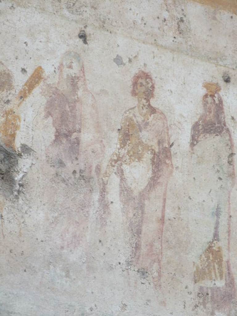 Detail of Venus, Mercury and Proserpina outside IX.11.1. December 2006.
Venus: Long red Chiton, hip mantle pulled over her head, right hand on hip, Eros looks over her right shoulder. See Lararien und Fassadenbilder in den Vesuvstadten by Thomas Frohlich, F66, page 335-337.