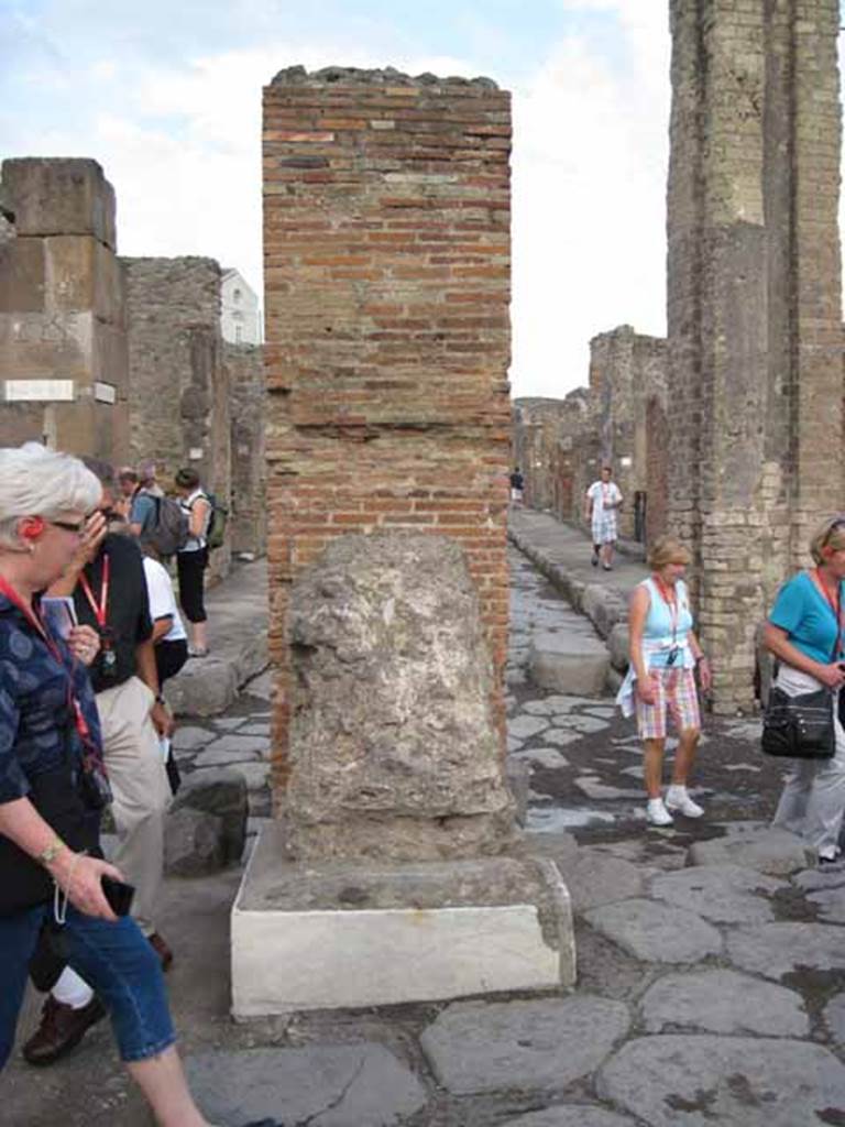 Arch of Marcus Holconius Rufus. September 2010. North-east pillar, west side. One of the four pillars supporting the arch. Photo courtesy of Drew Baker. According to Liselotte Eschebach, two statue bases had inscriptions. The second was to Holconia who was a priestess of Ceres. See Eschebach, L., 1993. Geb�udeverzeichnis und Stadtplan der antiken Stadt Pompeji. K�ln: B�hlau. (Pages 244-5). According to Cooley, the inscription accompanied an honorific statue to Holconia, which was probably part of the arch honouring her family. The inscription was �To Holconia, daughter of Marcus, public priestess�. See Cooley, A. and M.G.L., 2004. Pompeii : A Sourcebook. London : Routledge. (Page 101, E48). CIL X 950/1.
