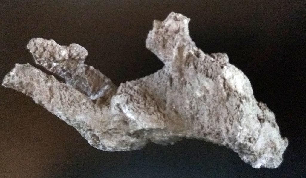 Victim 65 was probably young aged 13 to 19 years. Photograph © Parco Archeologico di Pompei.
The sex has not been determined.
The body was found outside the Porta Nola, near the tomb of M. Obellius Firmus, between the 2nd of August 1976 and the 2nd of August 1978.
The cast was unsuccessful, very incomplete and fragmentary, with undefined surfaces due to the stratigraphic position of the body, resting on the lapillus layer, as recorded in the Giornale di Scavo. Prior to restoration in 2015 the cast was in very poor condition, very incomplete, fragmentary, with complete fractures.
Foto Archivio PAP, neg. 38551(?), 38553 (?) are quoted as references.
See Osanna, N., Capurso, A., e Masseroli, S. M., 2021. I Calchi di Pompei da Giuseppe Fiorelli ad oggi: Studi e Ricerche del PAP 46, p. 472-3, Calco n. 65.