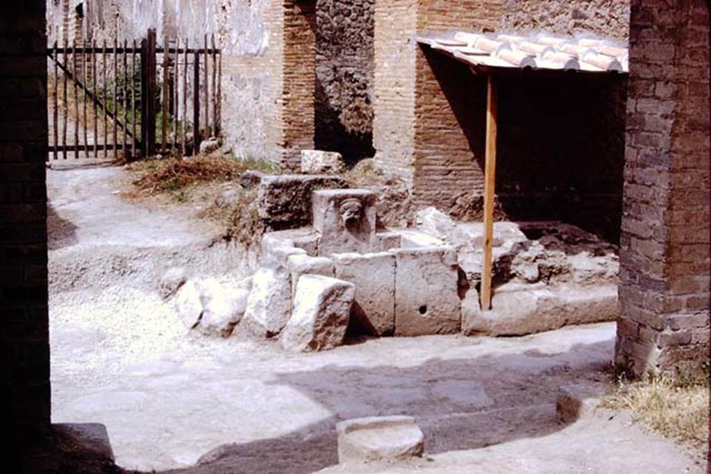 I.13.10 Pompeii. December 2005. Fountain outside I.13.10, possibly representing head of Juno or a nymph, with diadem.