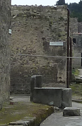 Fountain outside I.16.4 May 2006. Looking north towards south side of fountain basin.
