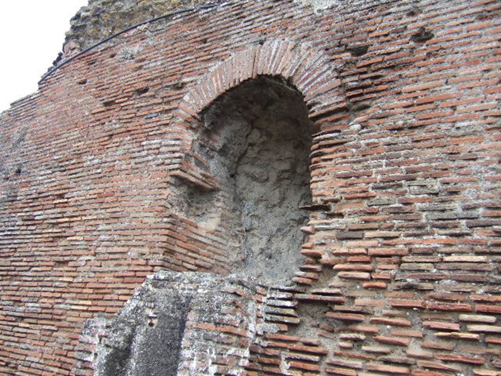 VII.5.8 Pompeii. Side wall with remains of water tower.