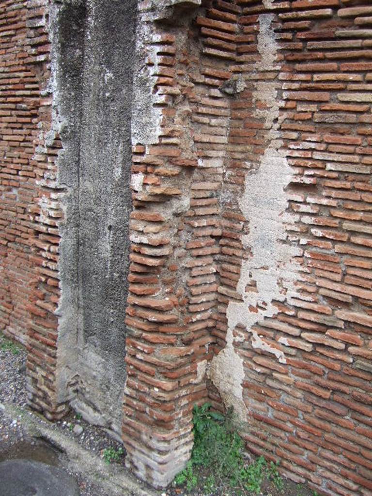 VII.5.8 Pompeii. Side wall with remains of water tower.