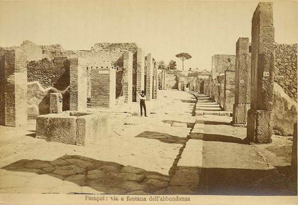 Fountain outside VII.14.13 and VII.14.14 on Via dell�Abbondanza. C.1880s. Looking east from near fountain.
In the distance is the �as-yet-unexcavated� area near Holconius crossroads. Photo courtesy of Rick Bauer.

