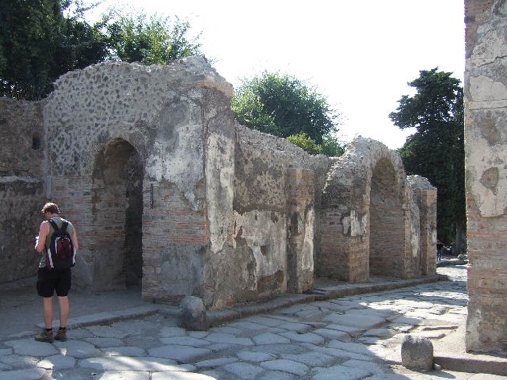 Porta Ercolano or Herculaneum Gate. Cippus of Suedius Clemens. Found 16th August 1763, on the south of the street close to the entrance to HGW05, almost opposite to the circular seat of Mamia. Now in Naples Archaeological Museum. Inventory number 3848.
The inscription reads
EX AVCTORITATE
IMP CAESARIS
VESPASIANI AVG 
LOCA PVBLICA A PRIVATIS
POSSESSA T SVEDIVS CLEMENS
TRIBVNVS CAVSIS COGNITIS ET
MENSVRIS FACTIS REI
PVBLICAE POMPEIANORVM
RESTITVIT      [CIL X 1018]

According to Epigraphik-Datenbank Clauss/Slaby (See www.manfredclauss.de) this reads

Ex auctoritate
Imp(eratoris) Caesaris
Vespasiani Aug(usti)
loca publica a privatis
possessa T(itus) Suedius Clemens
tribunus causis cognitis et
mensuris factis rei
publicae Pompeianorum
restituit      [CIL X 1018]

By virtue of authority conferred upon him by the Emperor Vespasian Caesar Augustus, 
Titus Suedius Clemens, tribune, having investigated the facts and taken measurements,
restored to the citizens of Pompeii public places illegally appropriated by private persons.

Similar Cippi were found at the Porta Ercolano, Porta Marina and the Porta Vesuvio.
The wording “rei publicae Pompeianorum” on one of these, discovered in 1763, was the first positive identification that the site was Pompeii. 
Until then scholars had divided opinions on the city buried under Civita. Many, including the first official excavators, thought it was the ancient city of Stabiae.
See Conticello, B., Ed, 1990. Rediscovering Pompeii. Rome: L’Erma di Bretschneider. (p. 225).