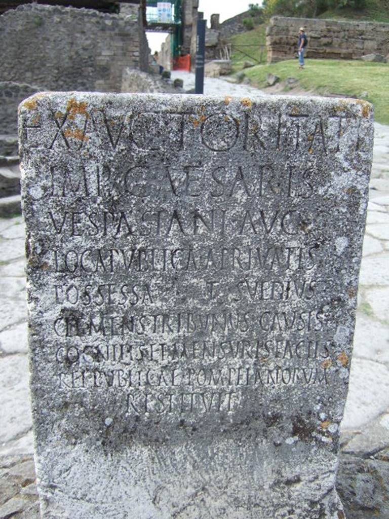 Pompeii Porta Nocera. Cippus of Titus Suedius Clemens. The Cippus is inscribed:
Ex auctoritate
imp(eratoris) Caesaris
Vespasiani Aug(usti)
loca publica, a privatis
possessa T(itus) Suedius
Clemens tribunus causis c
ognitis et mensuris factis
rei publicae Pompeianorum
restituit,
By virtue of authority conferred upon him by the Emperor Vespasian Caesar Augustus, Titus Suedius Clemens, tribune, having investigated the facts and taken measurements, restored to the citizens of Pompeii public places illegally appropriated by private persons. Similar Cippi were found at the Porta Ercolano, Porta Marina and the Porta Vesuvio. The wording “rei publicae Pompeianorum” on one of these, discovered in 1763, was the first positive identification that the site was Pompeii. Until then scholars had divided opinions on the city buried under Civita. Many, including the first official excavators, thought it was the ancient city of Stabiae. See Conticello, B., Ed, 1990. Rediscovering Pompeii. Rome: L’Erma di Bretschneider. (p. 225).