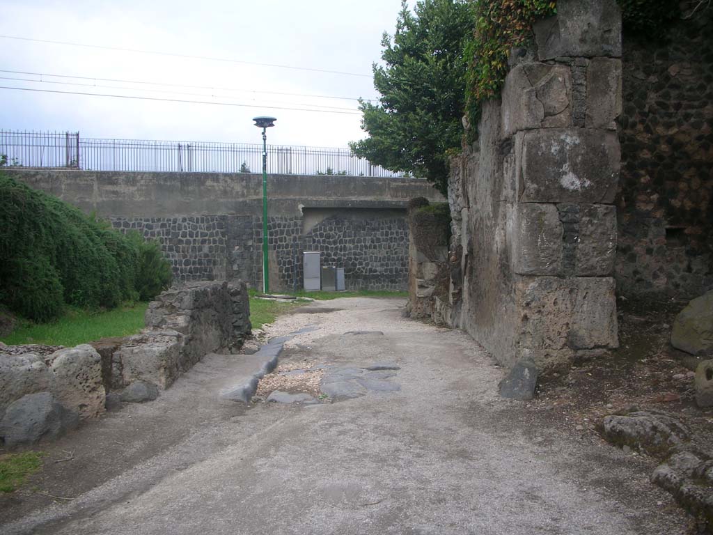 Outside Sarnus Gate. September 2005. Looking north west at old wall and modern railway bridge.