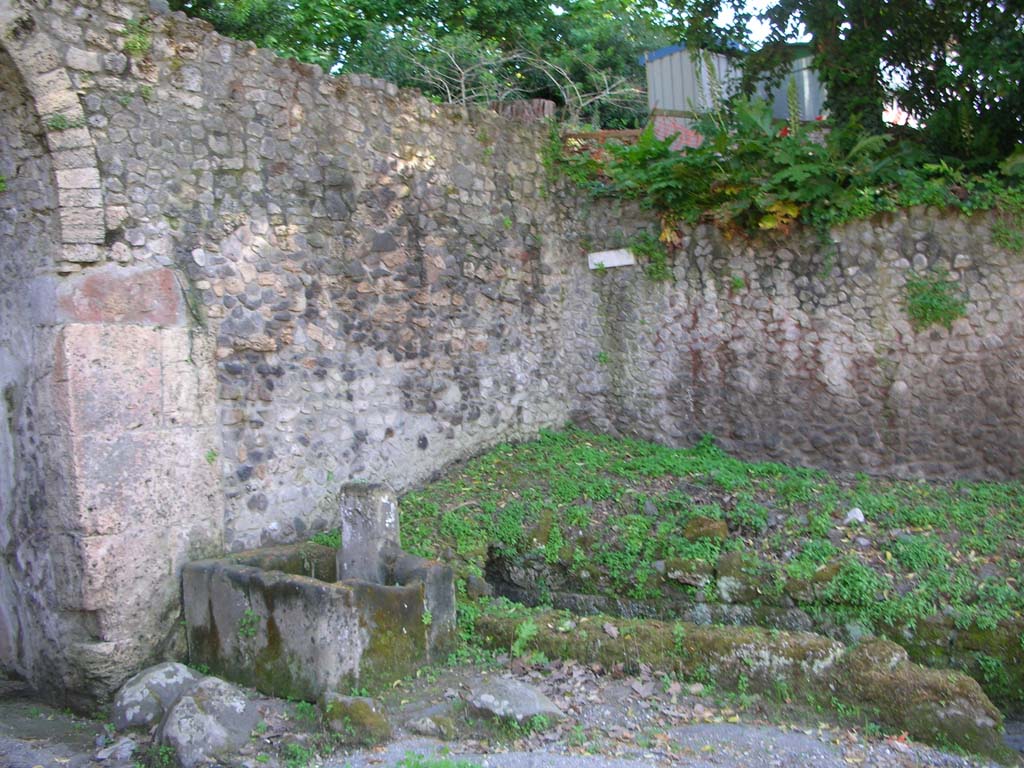 Porta Stabia, Pompeii. May 2010.
Looking towards north-west side of gate, with fountain and course of drain. Photo courtesy of Ivo van der Graaff.