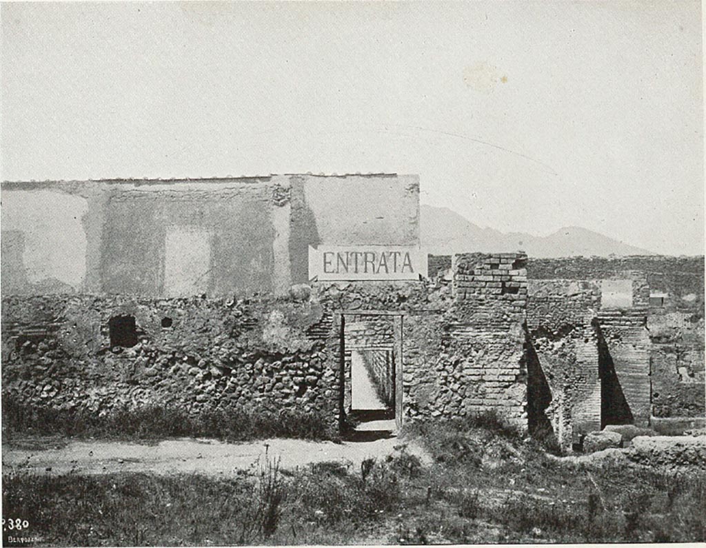 VIII.7.16 Pompeii. c.1907-1908. Photograph titled “Attuale entrata dal ludo gladiatorio”.
Looking north to small entrance at exterior south-east corner of Gladiator’s Barracks, an original entry to excavations of Pompeii.
According to Sogliano –
“………..and the very petty and inconvenient entry into Pompeii, made a few years ago, from a narrow corner of the Ludo Gladiatorium. I will take care of this last filthy situation immediately, transferring the entrance to the Porta di Stabia, in the same way as one accesses the excavations by the Porta Marina and the Porta Nola.”
See Sogliano, A. (1908). Dei lavori eseguiti in Pompei dal 1 Aprile 1907 a tutto Giugno 1908. (p. 16 and fig. 7).