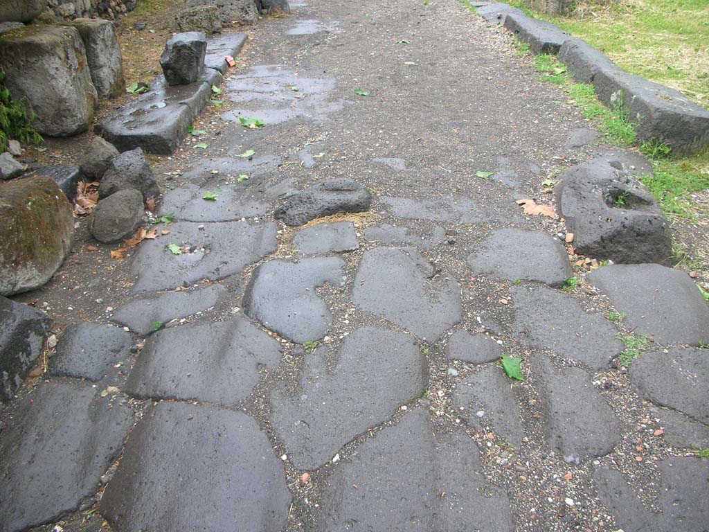Vesuvian Gate Pompeii. May 2010.
Looking north along roadway towards site of doorway, with small block of lava, in centre, for door to close against. Photo courtesy of Ivo van der Graaff.
See Notizie degli Scavi di Antichità, 1906, p. 97-100.