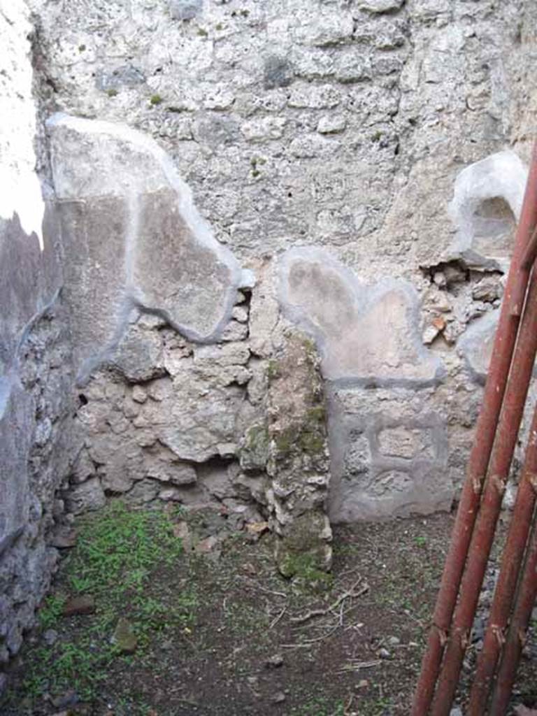 .2.18/19 Pompeii. September 2010.
Looking south into small room in south-east corner. Latrine and kitchen? Photo courtesy of Drew Baker.
According to Fiorelli, the room with the latrine had a hollow in the wall for placing a lamp.
See Pappalardo, U., 2001. La Descrizione di Pompei per Giuseppe Fiorelli (1875). Napoli: Massa Editore. (p.36)
According to Boyce, in the south-west corner of the kitchen, built in a peculiar manner, was an arched niche.
(height 0.30m, w.0.30m, d.0.25m, height above the floor 1.30m).
See Boyce G. K., 1937. Corpus of the Lararia of Pompeii. Rome: MAAR 14. (p.22, no.12B).