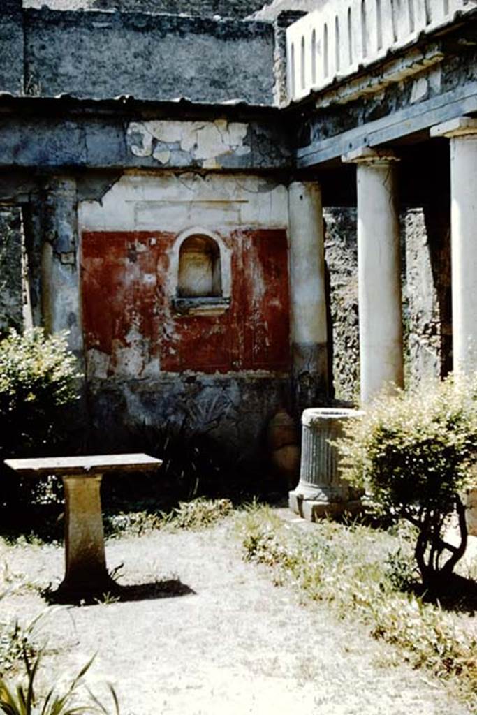 I.7.7 Pompeii. 1961. Lararium niche in west wall in north-west corner. Photo by Stanley A. Jashemski.
Source: The Wilhelmina and Stanley A. Jashemski archive in the University of Maryland Library, Special Collections (See collection page) and made available under the Creative Commons Attribution-Non Commercial License v.4. See Licence and use details.
J61f0807
According to Boyce, the arched niche was adorned with a stucco aedicula façade and a cornice running around the inside walls. The area of the wall immediately around the niche was painted as part of the decoration, into which the niche was set in a panel. There was no lararium painting and no other indication of religious use. It is called an edicoletta larare in the report and probably was a shrine, as there was no other in the house.
Not. Scavi, 1927, 27.
See Boyce G. K., 1937. Corpus of the Lararia of Pompeii. Rome: MAAR 14. (p.25, no.39)