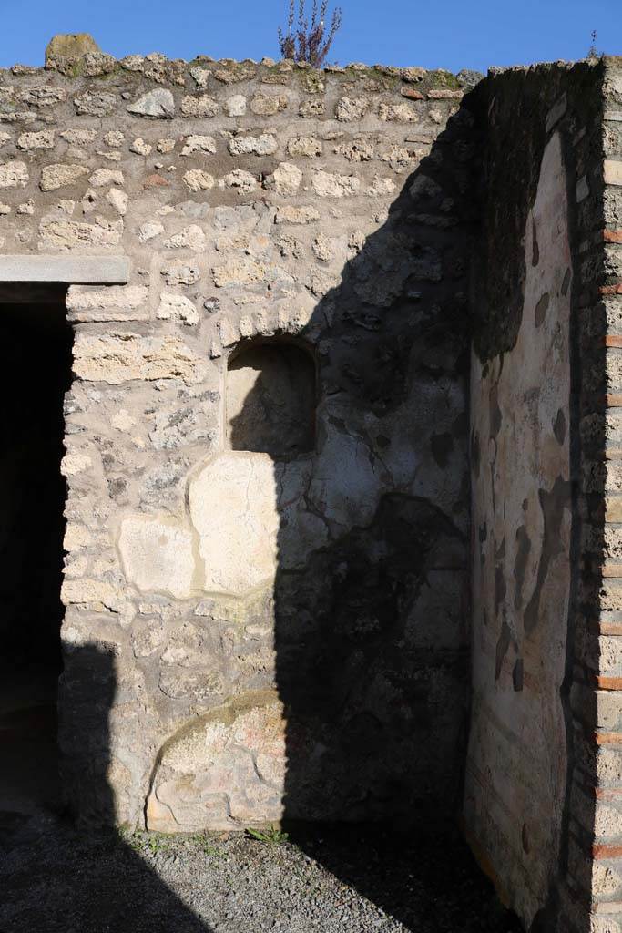 I.7.11 Pompeii. December 2018.
Remains of lararium on east side of atrium belonging to original house I.7.10.
Photo courtesy of Aude Durand.