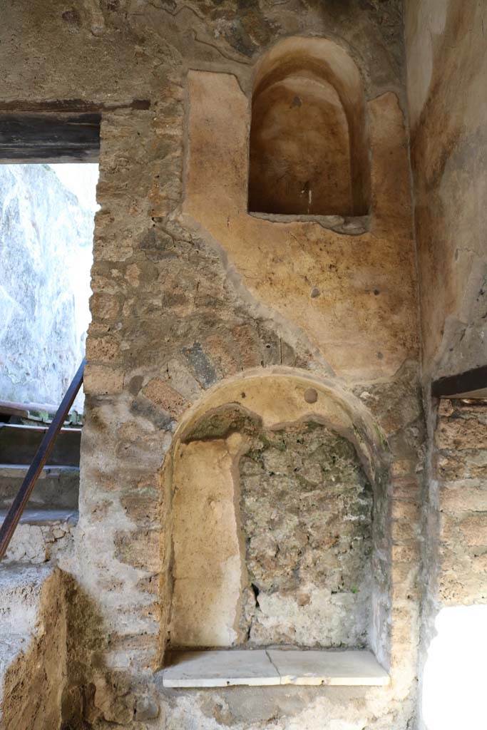 I.7.19 Pompeii. December 2018.
North wall in north-east corner with two niches. Photo courtesy of Aude Durand.
According to Boyce, in the north wall are two arched niches at different levels.
The lower is the larger and has a slab of marble as its floor.
See Boyce G. K., 1937. Corpus of the Lararia of Pompeii. Rome: MAAR 14. (p.26, no.42).