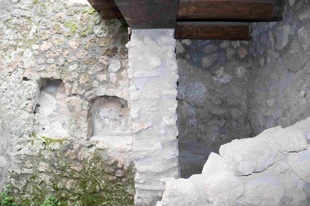 I.10.1 Pompeii. December 2018.
Looking south towards two niches on wall of uncovered area, and third niche on south wall of latrine. Photo courtesy of Aude Durand.