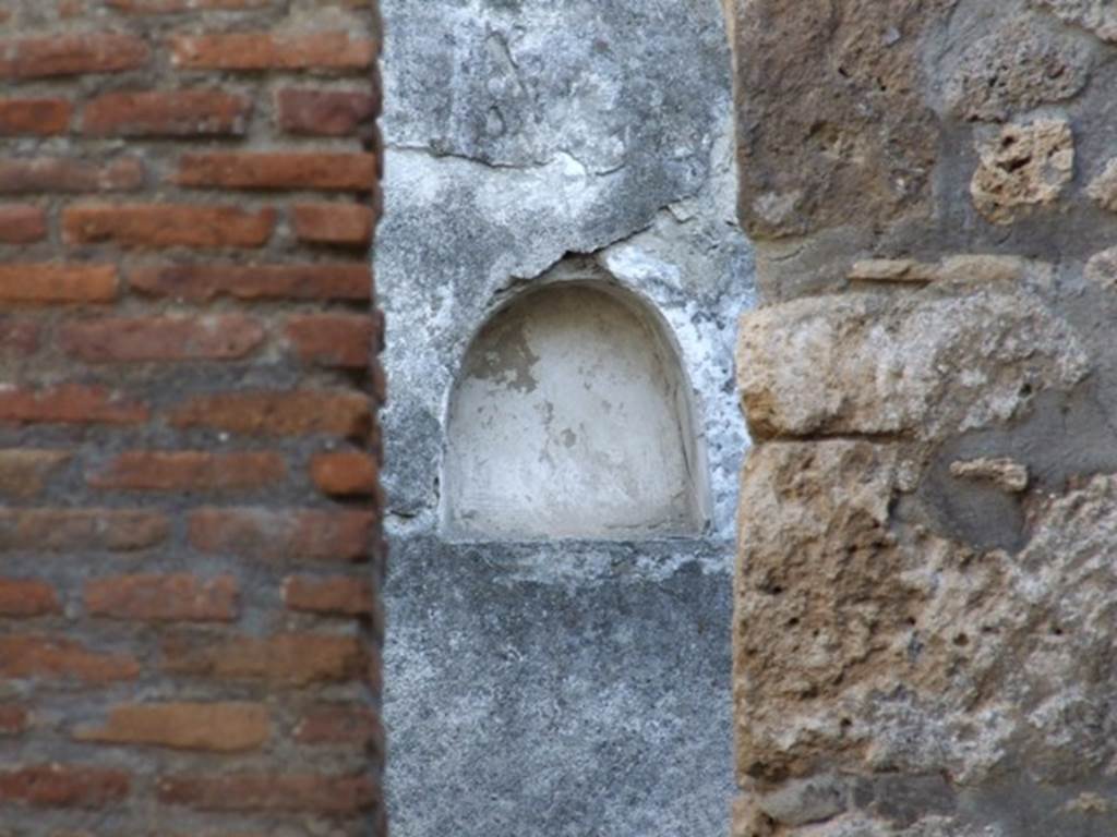 I.11.3 Pompeii. December 2007. Niche on south wall of the garden viewed through kitchen doorway.