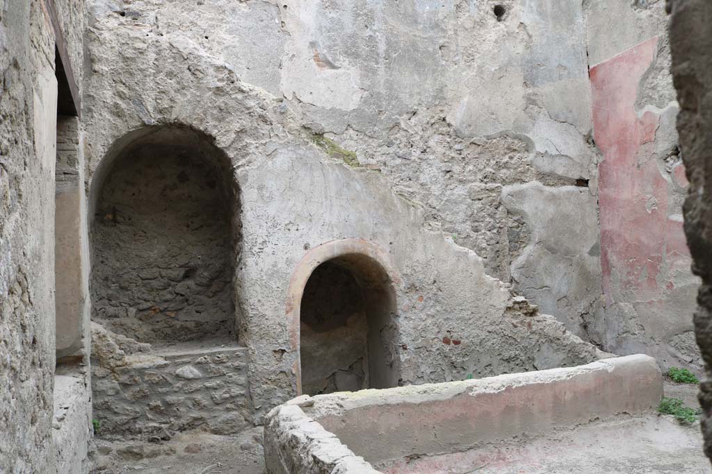 I.12.5 Pompeii. December 2018.
Looking east across garden area towards two masonry alcoves built under the stairs against the east wall.
Photo courtesy of Aude Durand.