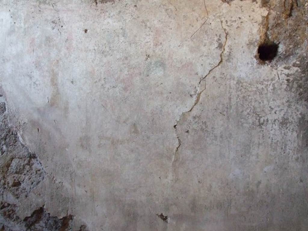 I.12.9 Pompeii. December 2007. East wall of kitchen. According to PPP and Giacobello, on the east wall of the kitchen above the bench was a lararium, now completely disappeared. According to PPP, the Lararium was shown with altar, offerings, a Lar, and a decayed serpent.
According to Giacobello, in the upper part was the figure of the Genius sacrificing near an altar. He was assisted by two people, presumably the camillo and the tibicine. On his left, was a painted Lar with his arm held high, near to him was a large ham. Upon discovery, the serpent near an altar in the lower zone was only partially conserved. See Giacobello, F., 2008. Larari Pompeiani: Iconografia e culto dei Lari in ambito domestico. Milano: LED Edizioni. (p.153) See Bragantini, de Vos, Badoni, 1981. Pitture e Pavimenti di Pompei, Parte 1. Rome: ICCD. (p.176)