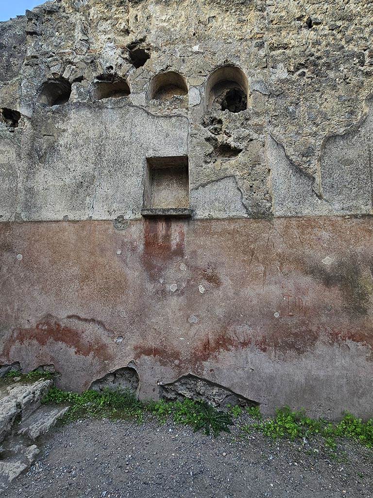 II.2.3 Pompeii. November 2024.
South end of west wall of bar-room, with niches. Photo courtesy of Annette Haug.