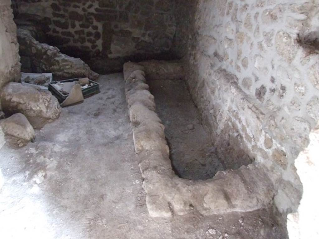 III.2.1 Pompeii. March 2009.
Room 11, looking towards the south-east corner and south wall with remains of hearth/bench.