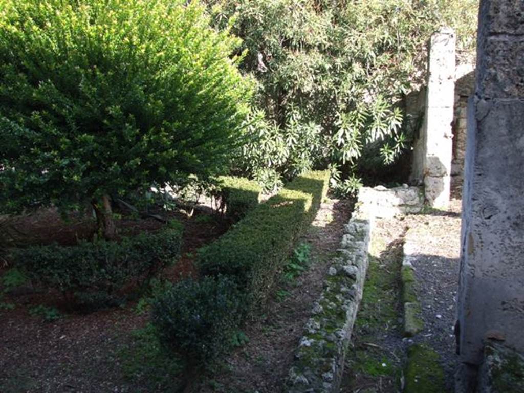 V.2.4 Pompeii. December 2007. Room 13, peristyle drainage channel, looking east towards south-east corner. According to Boyce, in the south-east corner of the garden were painted the two familiar serpents. One on each wall, one on the south and one on the east wall. The altar was painted between them in the corner of the wall. The serpents were brown and yellow on a white ground.
See Boyce G. K., 1937. Corpus of the Lararia of Pompeii. Rome: MAAR 14. (p.34, no.88)