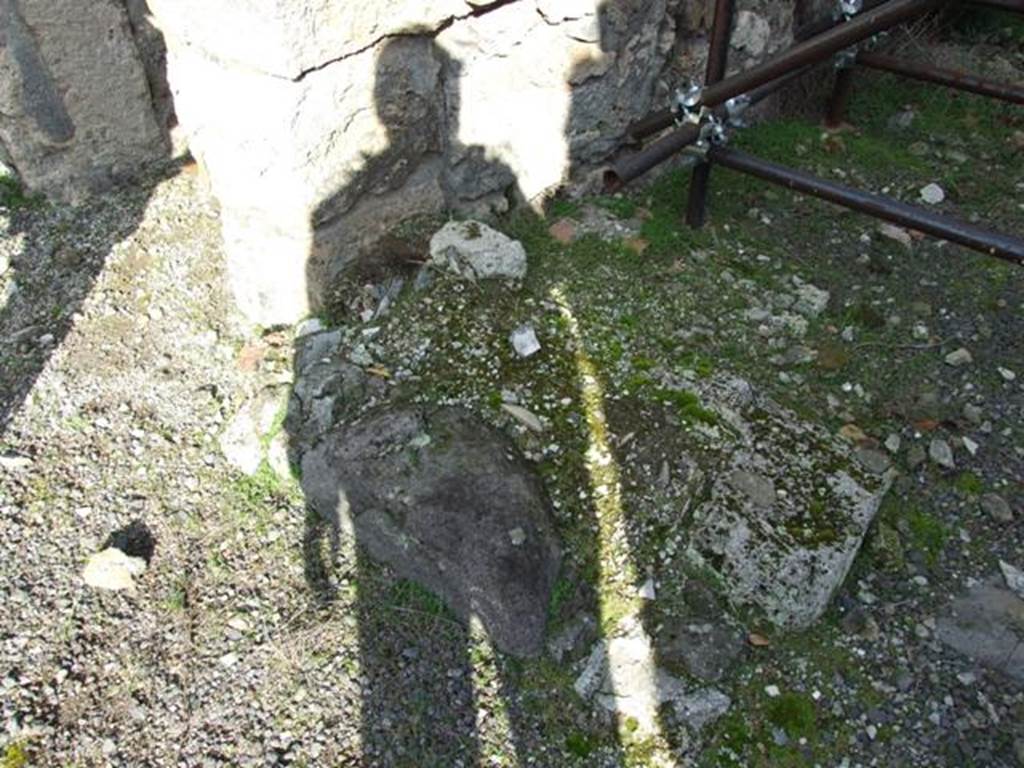 V.2.10 Pompeii. December 2007. Stone base on north-west corner of room 8.
According to Boyce –
In the front portico of the peristyle, on the east wall between the stair and the door to an adjacent room, a mass of masonry stands against the wall (w.1.22, d.0.60), flanked by two heavy antae, the height of which cannot be determined. Probably they rose to a height of about one metre and upon them rested a vault or some sort of roof and this was the aedicula for the domestic worship.
See Boyce G. K., 1937. Corpus of the Lararia of Pompeii. Rome: MAAR 14. (92, p. 34)
According to NdS, between the rustic room 8, and the stairs to the upper floor, was a recessed seat between two walls and built against the dividing room pilaster.
See Notizie degli Scavi di Antichità, 1896, (p.437)