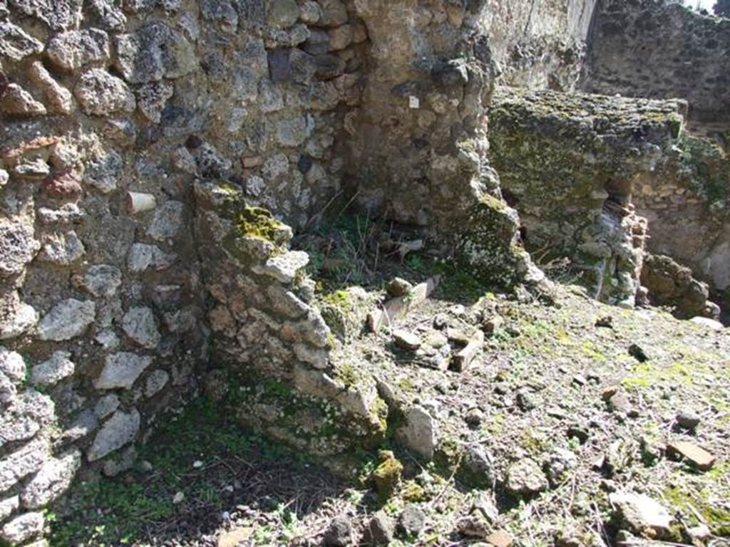 V.4.9 Pompeii. March 2009. Looking south-east towards site of latrine. According to Boyce, in the small room to the left of the entrance, on the south wall near the latrine, was a painting of Fortuna. This is no longer visible.
See Boyce G. K., 1937. Corpus of the Lararia of Pompeii. Rome: MAAR 14. (p.41, no.122)