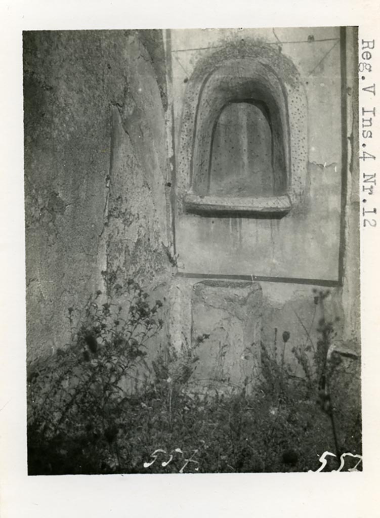 V.4.13 Pompeii but shown as V.4.12 on photo. Pre-1937.
Looking towards lararium niche in north-west corner of garden area, and masonry altar.
Photo courtesy of American Academy in Rome, Photographic Archive. Warsher collection no. 557.