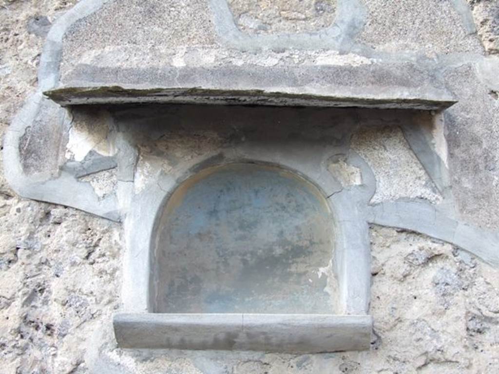VI.7.3 Pompeii. March 2009. Room 1, niche on north wall of atrium.
According to Boyce, this was a carefully executed arched niche. Below it was a heavy cornice adorned with a frieze of polychrome stucco work projecting from the wall. The niche itself was originally framed by an aedicula façade, of which only the half-columns at the sides remained.
A stucco cornice running around the curve of the arch was also visible to Boyce. See Boyce G. K., 1937. Corpus of the Lararia of Pompeii. Rome: MAAR 14. (p.47, no.160, and Pl.6,3)