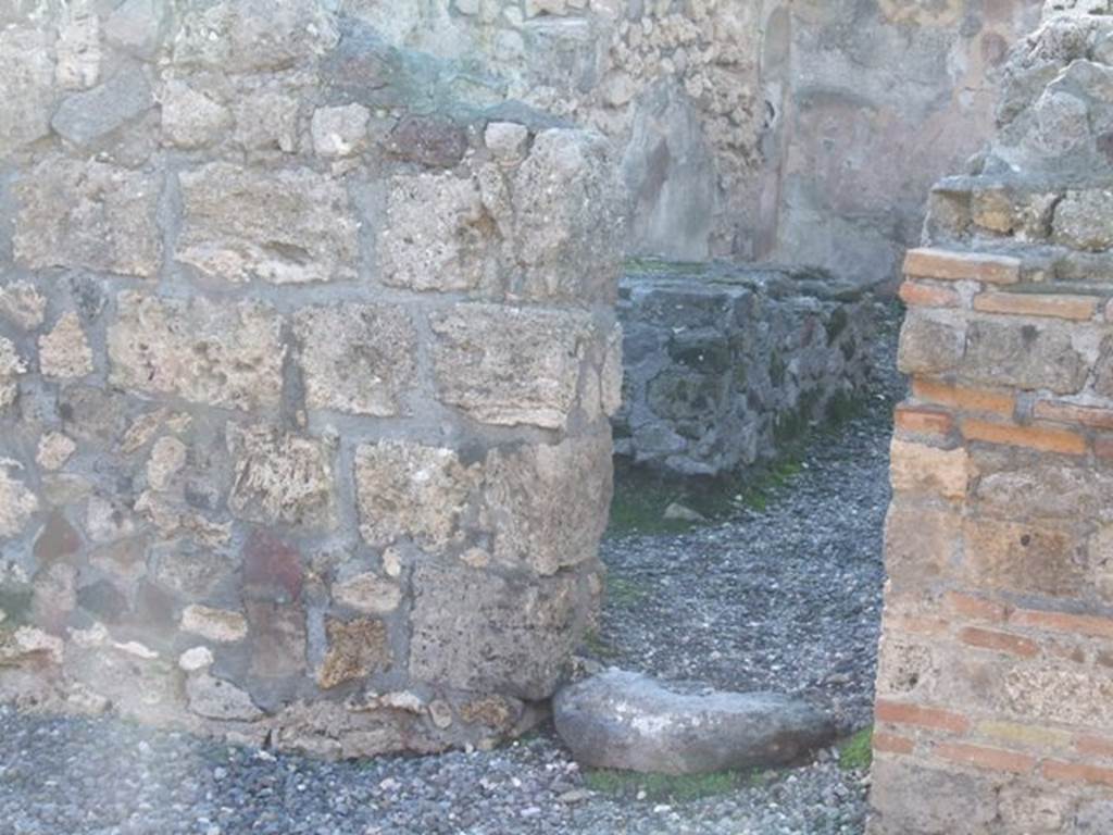 VI.7.11 Pompeii. December 2005. Entrance to room on west side of atrium, with hearth and water cistern.