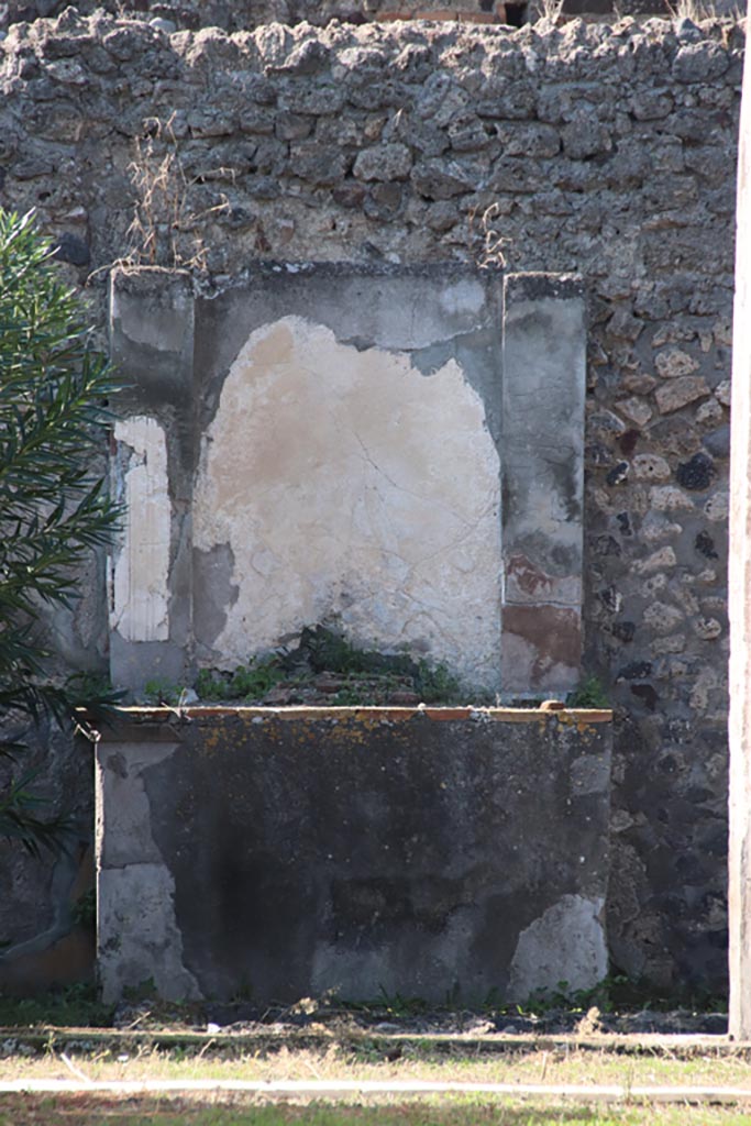 VI.7.20 Pompeii. October 2022.
Looking west to altar in peristyle. Photo courtesy of Klaus Heese.
According to Boyce –
Against the west wall of the pseudo-peristyle stands a huge aedicula.
See Boyce G. K., 1937. Corpus of the Lararia of Pompeii. Rome: MAAR 14, (p.48, no.166).
See Giacobello, F., 2008. Larari Pompeiani: Iconografia e culto dei Lari in ambito domestico. Milano: LED Edizioni, (p.270 no.V45)
