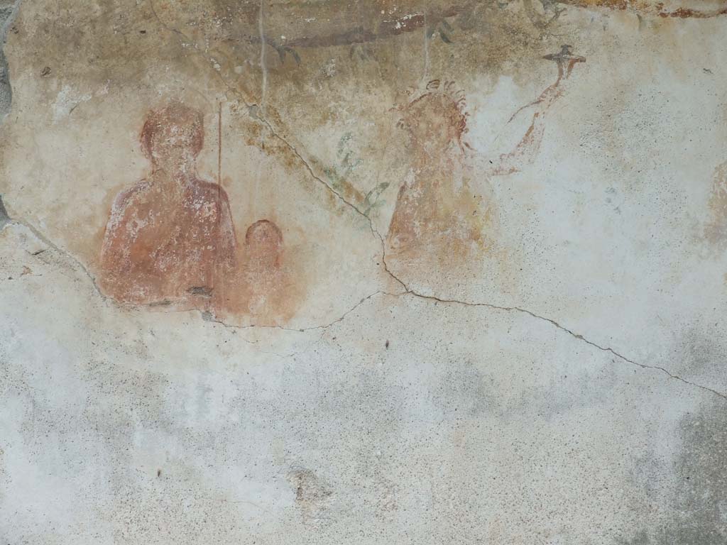 VI.11.9 Pompeii. December 2006.
Room 16. Household lararium showing Venus Pompeiana, Amor or Eros, and a Lar. A garland can be seen above.