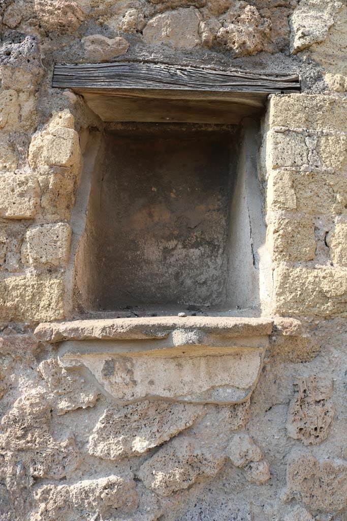 VI.14.4 Pompeii. December 2018. Niche in north wall of shop. Photo courtesy of Aude Durand.
According to Boyce -
in the north wall is a rectangular niche (h.0.45, w.0.35, d.0.30, h. above the floor 1.60), its inside walls coated with white stucco.
Its floor projected as a narrow shelf.
See Boyce G. K., 1937. Corpus of the Lararia of Pompeii. Rome: MAAR 14. (p. 52, no.196)