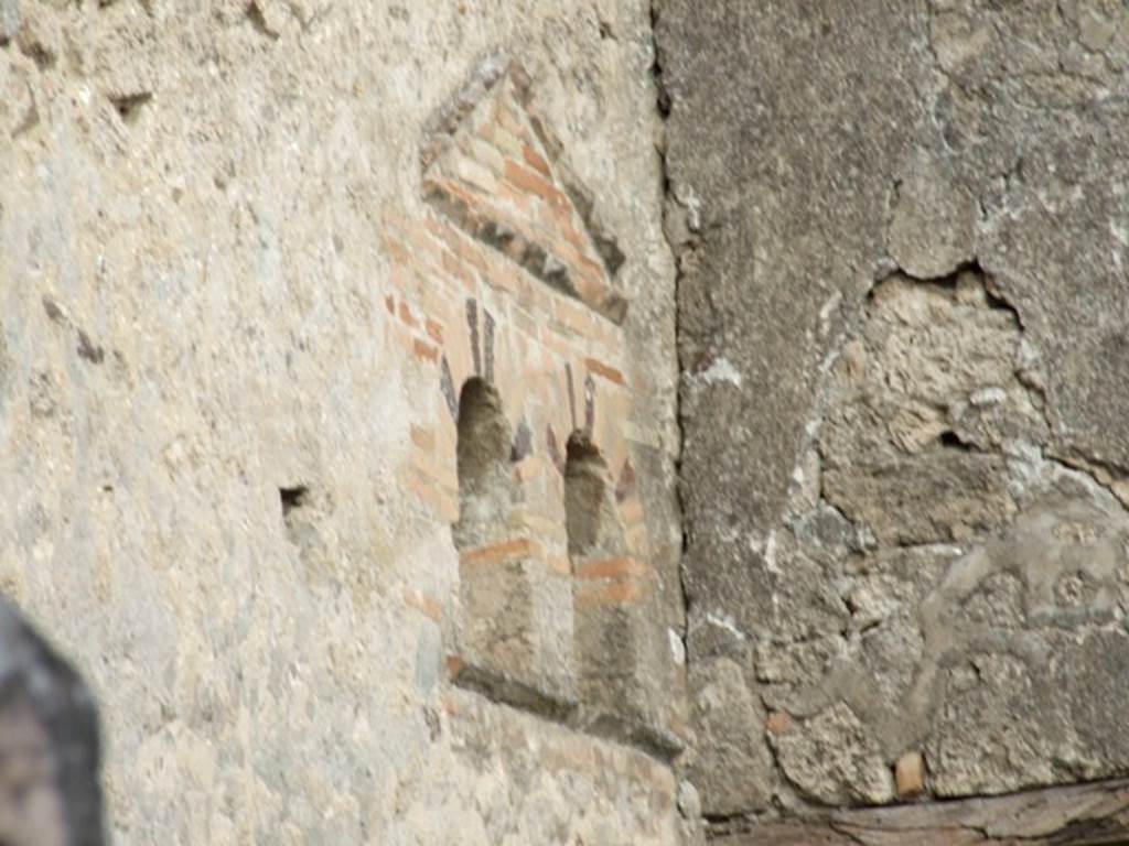 VI.14.40 Pompeii. December 2007. Double niche on north wall of atrium.
According to Boyce, at the extreme east end of the north wall of the atrium, are two vaulted niches, side by side and 3.22m above the floor.
Above them both is a single pediment formed of projecting tiles.
See Boyce G. K., 1937. Corpus of the Lararia of Pompeii. Rome: MAAR 14. (p. 54, no.207, with Pl.4, 6).