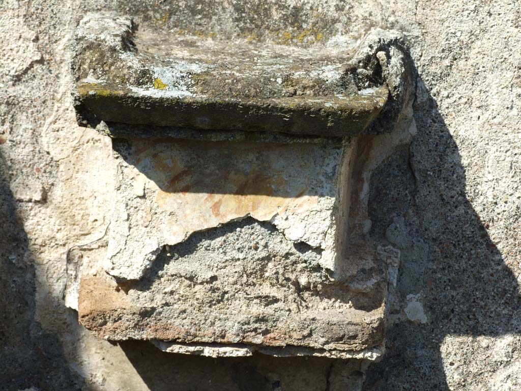 VI.16.12 Pompeii. March 2009. Masonry altar on north wall. According to Boyce, the altar was painted to represent coloured marble.
Painted above it on the wall were a pine cone, egg and fruit.
See Boyce G. K., 1937. Corpus of the Lararia of Pompeii. Rome: MAAR 14. (No.223, p58, Pl.28, 1)
