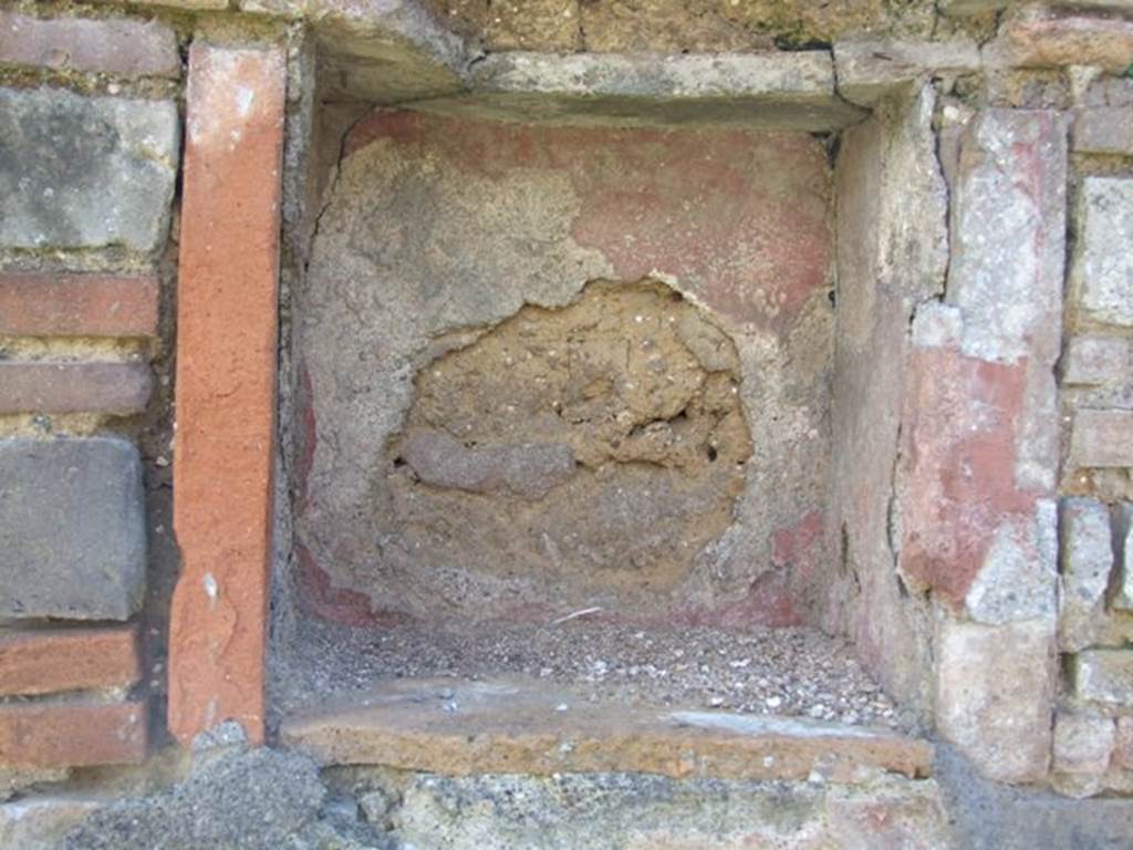VI.16.20 Pompeii. March 2009. Niche in south wall, originally this may have been in a rear room of VI.16.21/22. According to Boyce, numbered VI.16.20-24. In the central room on the south side of the house is a rectangular niche. It is in the north side of a pilaster which projects from the east wall (now collapsed). On the wall below the niche, were painted two large yellow serpents on a red background. Not. Scavi, 1908, 182.
See Boyce G. K., 1937. Corpus of the Lararia of Pompeii. Rome: MAAR 14. (p.59, no.225)