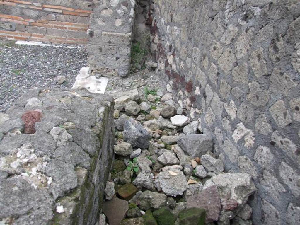 VI.17.10 Pompeii. December 2007. Remains of sacrarium? or remains of staircase to upper floor?, on north side of entrance. According to Boyce, Fiorelli reported here a shrine, no longer to be seen: “La casa……tiene ai lati della porta un sacrario”. Fiorelli, Descr., 432.
See Boyce G. K., 1937. Corpus of the Lararia of Pompeii. Rome: MAAR 14. (p.59, no.231)
See Pappalardo, U., 2001. La Descrizione di Pompei per Giuseppe Fiorelli (1875). Napoli: Massa Editore. (p.159)