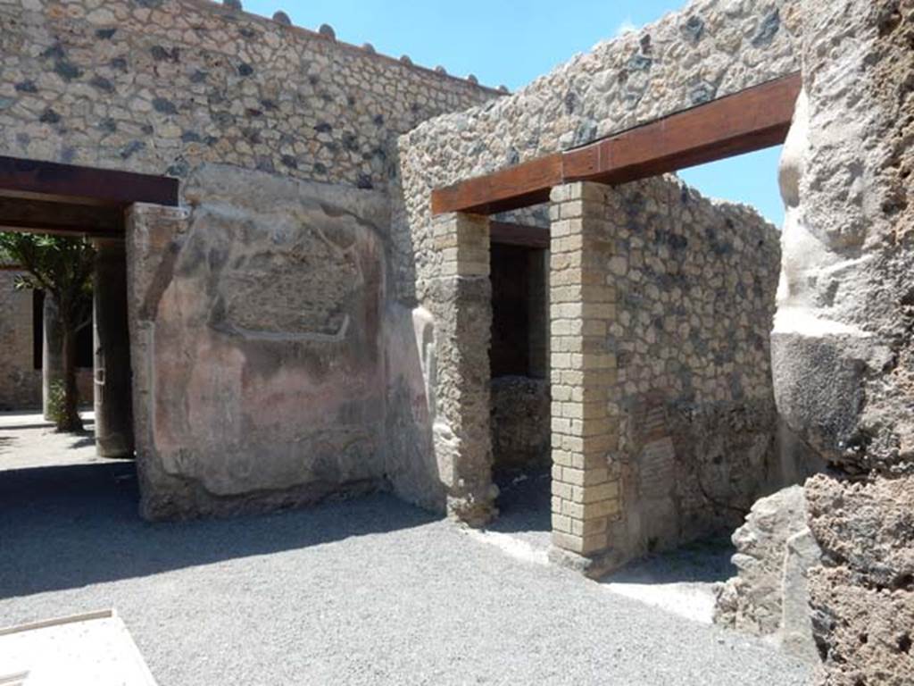 VII.1.25 Pompeii. May 2017. Looking towards north-west corner of atrium.
On the left is the entrance to the peristyle 31, and on the right, are the doorways to rooms 28 and 27, on the north side of the atrium 24.
Photo courtesy of Buzz Ferebee.
According to Fiorelli –
On the right of the atrium, are two cubicula, and the Niche of the Penates.
(“Stanno a destra dell’atrio due cubicoli e la nicchia de’Penati.”)
See Pappalardo, U., 2001. La Descrizione di Pompei per Giuseppe Fiorelli (1875). Napoli: Massa Editore. (p.76).
According to Boyce –
In the north wall of the atrium entered at No.25 Fiorelli reports la nicchia de’Penati, where Minervini saw only a window.
See Boyce G. K., 1937. Corpus of the Lararia of Pompeii. Rome: MAAR 14. (p.60, no.237).