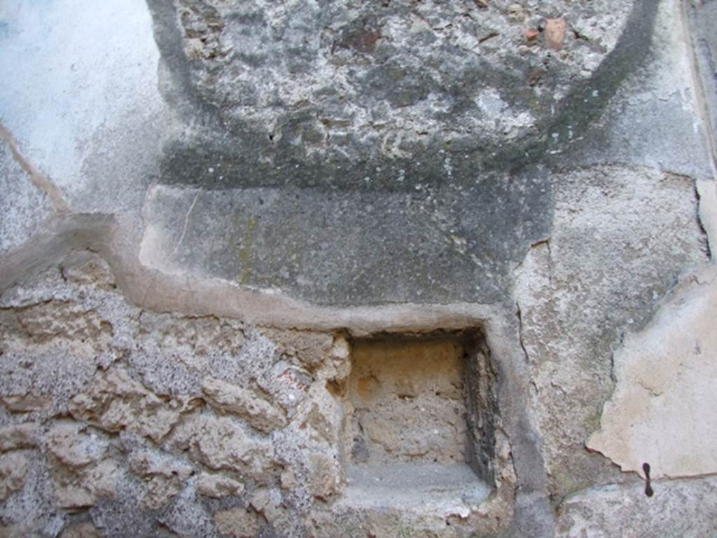 VII.2.14 Pompeii. March 2009. West wall of garden room. Square niche.
According to Boyce, the walls of this small garden were painted with garden subjects, trees, birds and fountain. Later a lararium painting was superimposed on part of it. In the west wall was set a rectangular niche.
Underneath it and to its right, a masonry altar was built into the corner and covered with yellowish stucco painted as imitation marble.
See Boyce G. K., 1937. Corpus of the Lararia of Pompeii. Rome: MAAR 14. (p.61-2, 249)