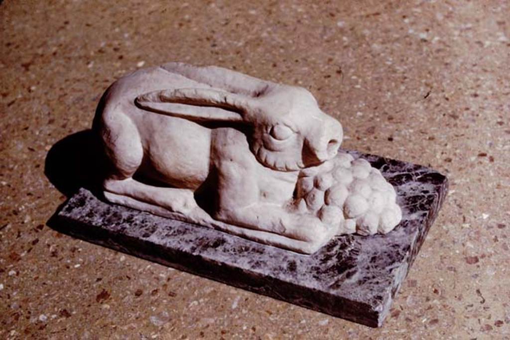 M.7. Pompeii. 1964. (Where from originally ?) Hare fountain statuette. The base is modern. Photo by Stanley A. Jashemski.
Source: The Wilhelmina and Stanley A. Jashemski archive in the University of Maryland Library, Special Collections (See collection page) and made available under the Creative Commons Attribution-Non Commercial License v.4. See Licence and use details.
J64f1774
Now in Naples Archaeological Museum. Inventory Sangiorgio Vol. 82 n. 742.
