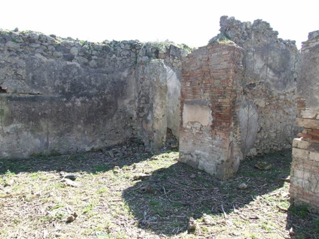 I.2.15 Pompeii. March 2009. Doorways to two rooms on west side of atrium.
According to Warscher, quoting Mau in Bull.Inst, 1873, p.240, she wrote �
�Adesso le pareti della casa in questione sono nude. Nell�anno 1873 Mau ha scritto �
�Un piccolo quadro molto distrutto si trova in una stanza a destra dell�atrio d�una casa sul lato del nord della stessa isola, la cui porta � la quarta contando dall�est.
Si distinguono due persone, delle quali quella seduta a sinistra � vestita di chitone giallo e clamide rossa. Mi pare essere un uomo. Gli sta dirimpetto un giovane che per il cappello e un bastone, che potrebbe essere un caduceo, forse deve ritenersi per Mercurio. Egli � vestito d�un chitone giallo, corto e cinto e d�una clamide che riposandogli sul braccio sinistra avvolge la parte media del corpo, lasciando libere le gambe.  Stende la mano destra verso la persona assisa�.
See Sogliano, A., 1879. Le pitture murali campane scoverte negli anni 1867-79. Napoli: Giannini. (p.37, no.152, described as �Hermes e figura indeterminata�).
See Warscher T., 1935. Codex Topographicus Pompeianus: Regio I.2. Rome: DAIR.
(translation: "Now the walls of the house in question are nude. In the year 1873 Mau wrote �  "A small very destroyed painting was located in a room to the right of the entrance hall of a house on the north side of the same insula, whose doorway was the fourth counting from the east. One can distinguish two people, the one sitting to the left was dressed in a yellow tunic and red cloak. It seemed to me to be a man.  He was facing a young man that by his hat and a cane, that may have been a caduceus, perhaps should be considered to be Mercury.  He was dressed in a short yellow tunic and girdle, and a cloak resting on his left arm that wrapped around the middle part of his body, leaving free the legs.  He was extending his right hand towards the seated person.")
