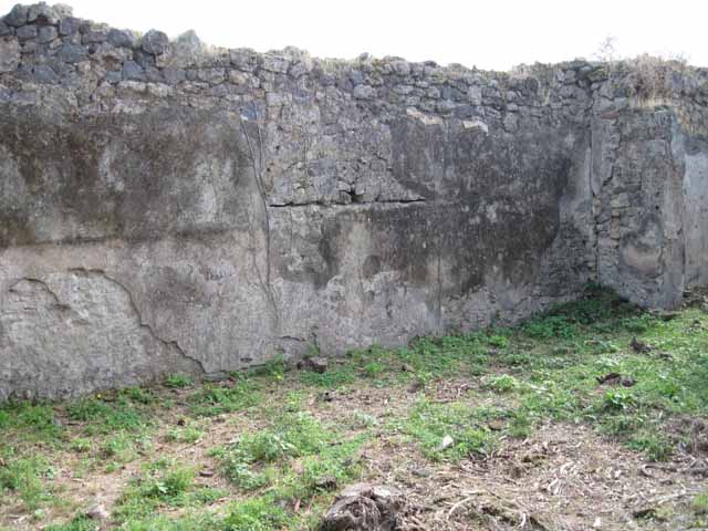 I.2.15 Pompeii. September 2010. Looking towards north wall of the atrium (north-west side) with entrance doorway in the centre. The corridor on the west side of the entrance can be seen on the left. Photo courtesy of Drew Baker.

