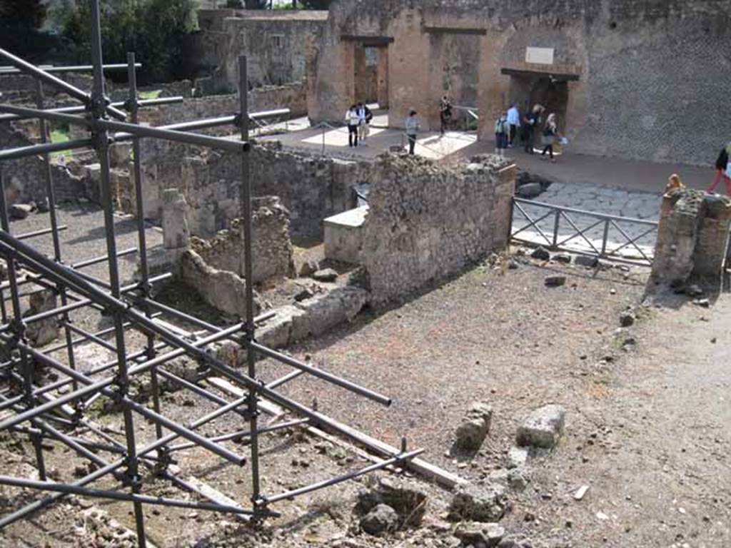 I.2.15 Pompeii. September 2010. Looking south-west from end of corridor on top of collapse. Photo courtesy of Drew Baker.
According to Garcia y Garcia, all the west part of the dwelling was completely destroyed in 1943. The bomb demolished the upper floor, leaving the cistern below uncovered and visible. See Garcia y Garcia, L., 2006. Danni di guerra a Pompei. Rome: L�Erma di Bretschneider.  (p.37)
