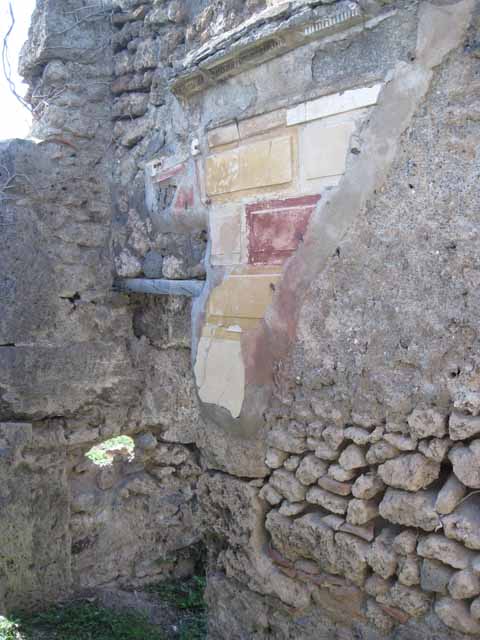 I.2.16 Pompeii. March 2009. Room 5, terracotta puteal and remains of fallen plaster near the east wall of cubiculum.