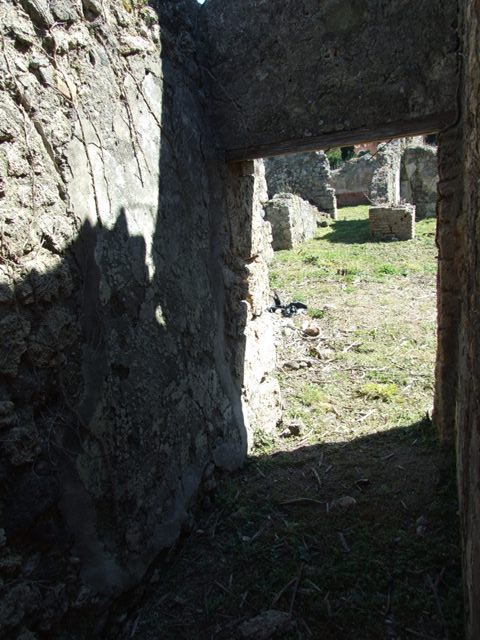 I.2.17 Pompeii. March 2009. North-east corner of atrium. Two doorways, room 2 – small room, and room 3- corridor to cupboard & kitchen room with stairs to upper floor.